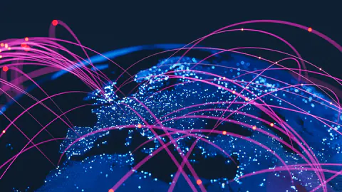 A luminous globe with blue and magenta connections spanning the world